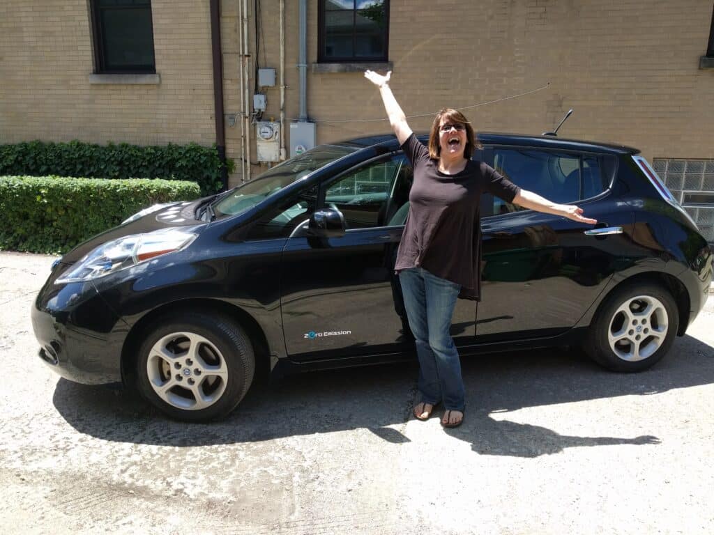 Jody with her electric vehicle