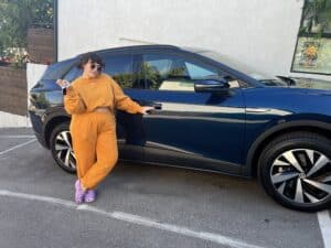 Car owner posed with their electric vehicle